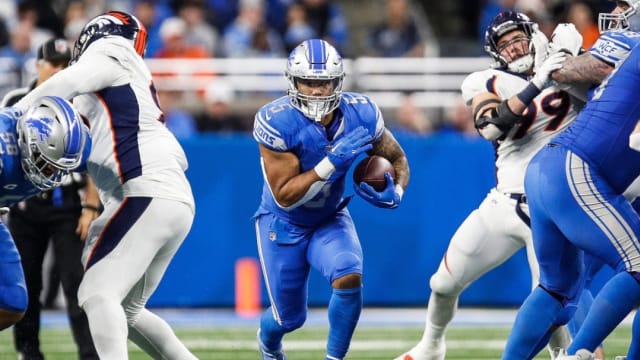 Detroit Lions running back David Montgomery runs with the ball against the Denver Broncos.